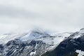 New fresh white snow on jagged mountain top in the arctic circle summer Royalty Free Stock Photo