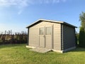 New garden house or shed in green lawn or grass