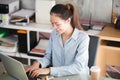 New generation asian business woman using laptop at office, Asian women sitting smiling while working on mobile office concept Royalty Free Stock Photo