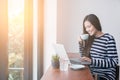 New generation asians business woman using laptop at coffee shop Royalty Free Stock Photo