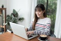 New generation asians business woman using laptop at coffee shop Royalty Free Stock Photo