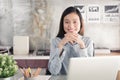 New generation asians business woman using laptop at office,Asian women sitting smiling while working on mobile office concept Royalty Free Stock Photo