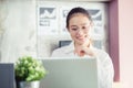 New generation asians business woman using laptop at office,Asian women sitting smiling while working on mobile office concept Royalty Free Stock Photo