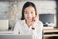 New generation asians business woman using laptop at office,Asian women sitting smiling while working on mobile office concept Royalty Free Stock Photo