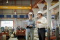 A new generation of engineers in a metal sheet factory. Studying work methods from supervisors or colleagues and studying by Royalty Free Stock Photo
