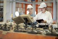 A new generation of engineers in a metal sheet factory. Studying work methods from supervisors or colleagues and studying by Royalty Free Stock Photo