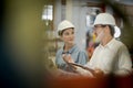 A new generation of engineers in a metal sheet factory. Studying work methods from supervisors or colleagues and studying by Royalty Free Stock Photo