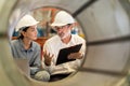A new generation of engineers in a metal sheet factory. Studying work methods from supervisors or colleagues and studying by Royalty Free Stock Photo