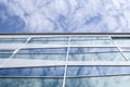 New glass building with reflecting clouds Royalty Free Stock Photo