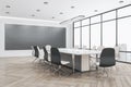 New glass meeting room office interior with window and city view, furniture, wooden flooring, equipment and daylight. Royalty Free Stock Photo