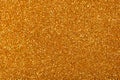 New glitter background for your individual design work, Christmas texture in gold tone. Royalty Free Stock Photo