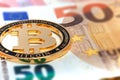 New Golden bitcoin on fifty euro banknotes background. Bitcoin crypto currency, Blockchain technology, digital money, Mining Royalty Free Stock Photo
