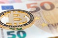 New Golden bitcoin on fifty euro banknotes background. Bitcoin crypto currency, Blockchain technology, digital money, Mining Royalty Free Stock Photo
