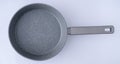 New granite frying pan on white background, top view. Empty fry pan with handle. Royalty Free Stock Photo