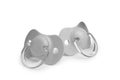 New grey baby pacifiers isolated on white