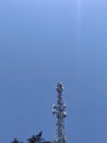 New GSM antennas on a high tower against a blue sky Royalty Free Stock Photo