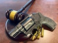 New Gun Regulations - Depicting a Judges gavel with a Weapon Royalty Free Stock Photo