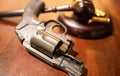 New Gun Regulations - Depicting a Judges gavel with a Weapon