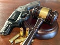 New Gun Regulations - Depicting a Judges gavel with a Weapon