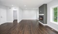 New hardwood flooring and fireplace have been installed in a home renovation Royalty Free Stock Photo