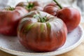 New harvest of big raddish-purple heirloom tomatoes Black Crimea