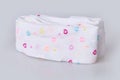 New hearts patterned folded child`s tights isolated on white