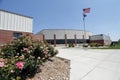 Generic High School Exterior with American Flag Royalty Free Stock Photo