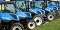 New Holland tractors in a row outside the local dealership of the american company.