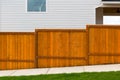 New Red Stained Garden Wood Fence Construction