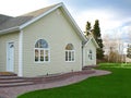 New home with brick walk and arch windows Royalty Free Stock Photo