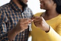 New Home Concept. Closeup Shot Of Happy Black Couple Holding Keys Together Royalty Free Stock Photo