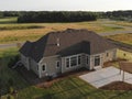 New home construction from above. Aerial view of suburban house. American neighborhood, suburb. Summer, sunny day