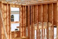 New home construction. build with wooden truss, post and beam framework. Royalty Free Stock Photo