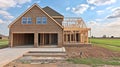 New Home Construction, Wood Frame and Truss Structure, Two-Car Garage, in Suburban Development. Royalty Free Stock Photo
