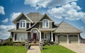 New Home House Custom Stucco Rockwork Exterior Dramatic Cloudy Sky Background Royalty Free Stock Photo