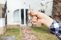 New home, house, property and tenant - Real estate agent handing a house key Royalty Free Stock Photo