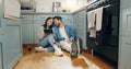 New home, renovation and couple with digital tablet on a kitchen floor for idea, search or inspiration. Real estate Royalty Free Stock Photo