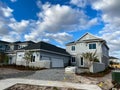 A new home that is under construction with brick pavers in the driveway in Lake Nona Orlando, Florida