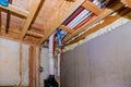 New home under construction plumbing PVC pipes inside a home framing with basement view Royalty Free Stock Photo