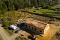 New home under construction in rural area with pine trees around it Royalty Free Stock Photo