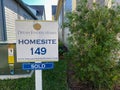 A new home that is under construction with a sign in the back yard that says Dream Finders Homes