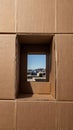 New Home View Through a Cardboard Box Window Royalty Free Stock Photo