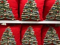 Display of cute Christmas tree novelty throw pillows on sale at a Target store