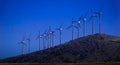 New Horizons. Renewable energy, wind mills on a hill. Royalty Free Stock Photo