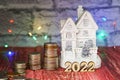 A new house as a gift. Money for the holiday. Holiday New Year and Christmas 2022 Royalty Free Stock Photo