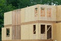 New house construction, framed walls plywood building lumber real truss Royalty Free Stock Photo