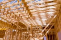 New house construction interior with wood roof trusses exposed framing Royalty Free Stock Photo