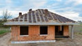 New house currently under construction against cloudy sky