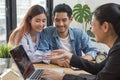 New house / home moving and relocation concept. Happy asian couple talking with apartment landlord from real estate agent /