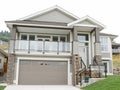 New House Home For Sale Beige Cream Exterior Elevation Rockwork Roof Details Royalty Free Stock Photo